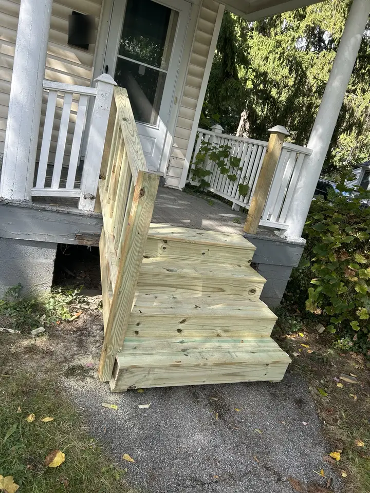 New pressure-treated front stairs with railing